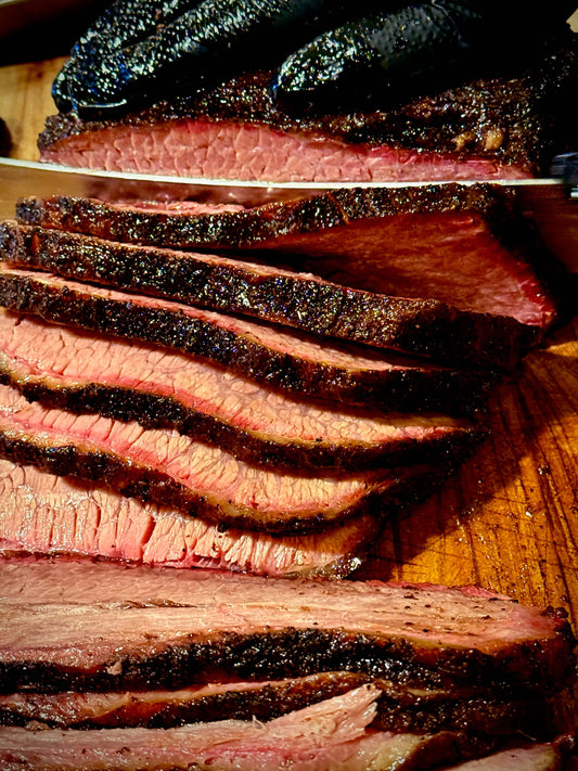 Tender smoked brisket slices with visible smoke ring in Phoenix, AZ