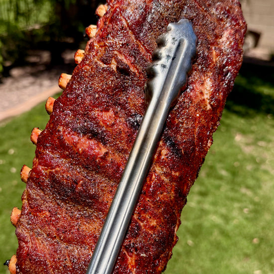 Video of bbq pork spareribs coming out of the smoker