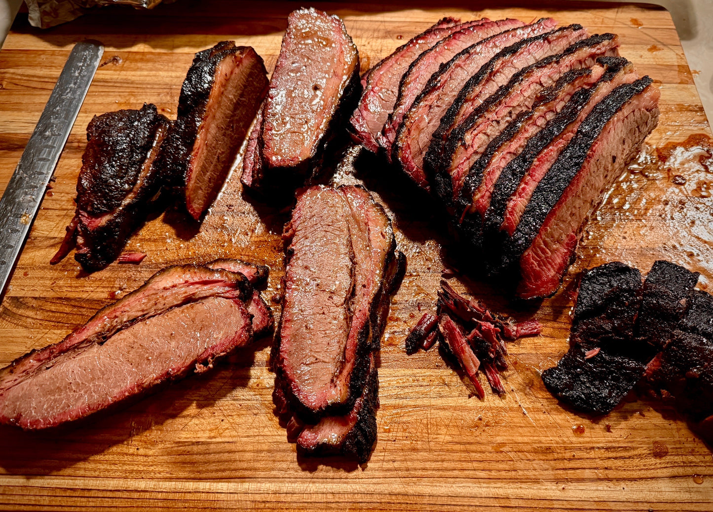 Slow smoked beef brisket with smoke ring and bark exterior in Phoenix, AZ